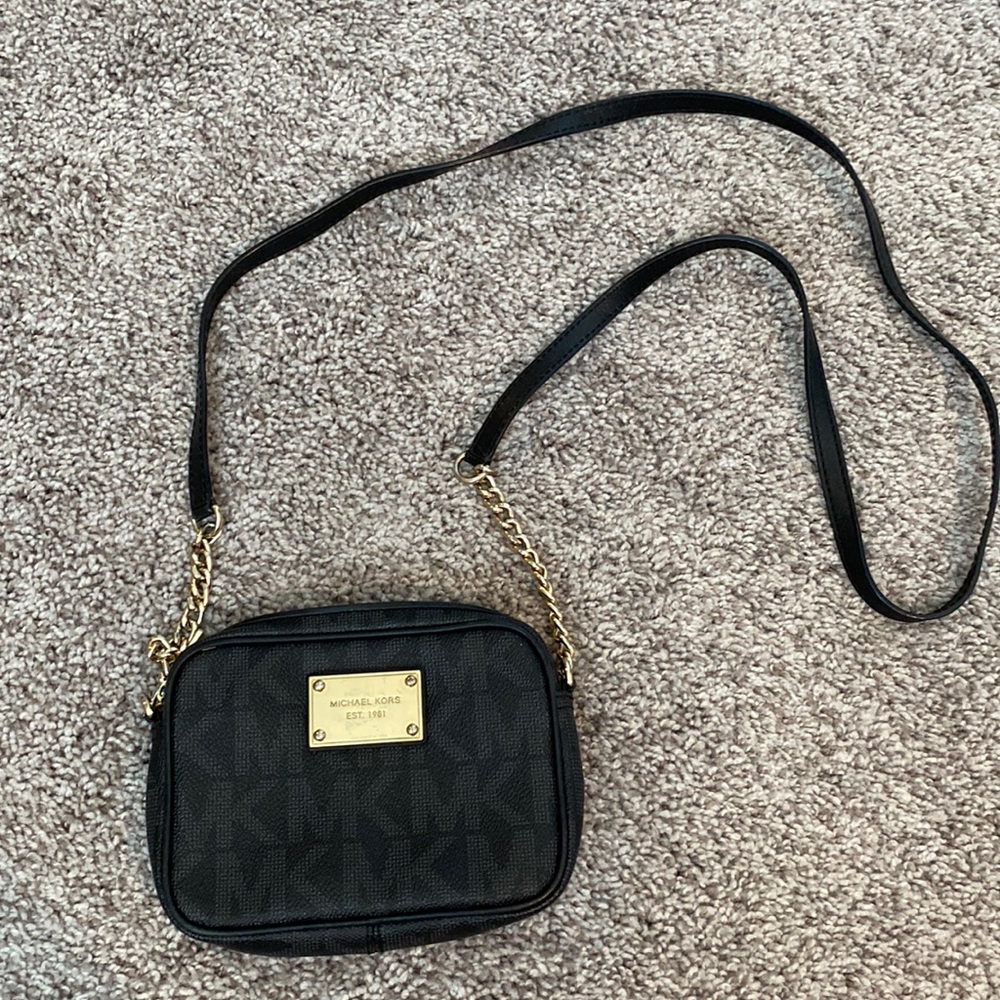 Black Michael Kors Crossbody with gold detail.